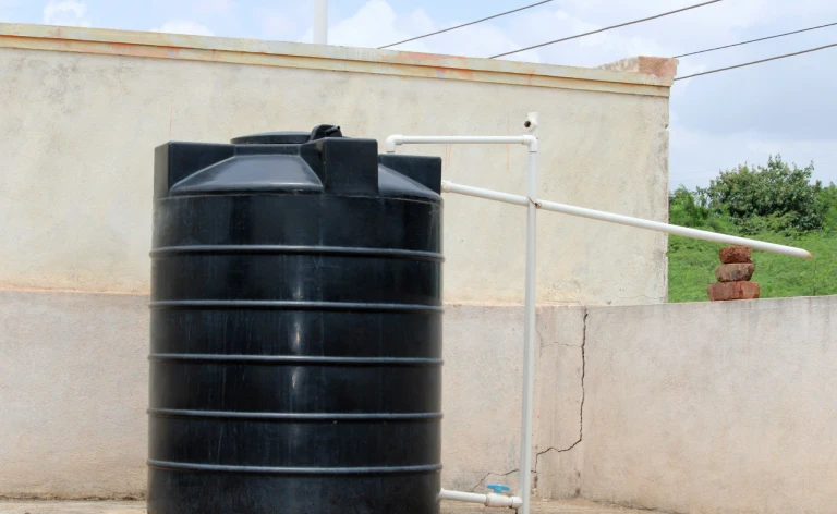 A water heater tank on a rooftop