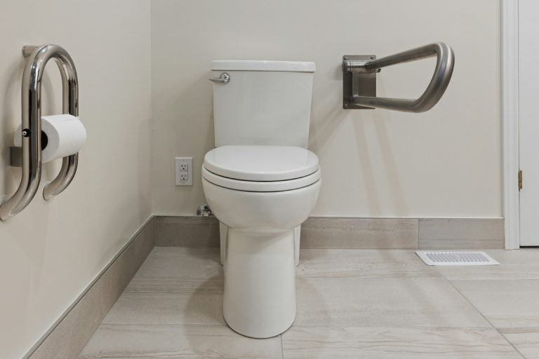 A white, clean toilet in a bathroom