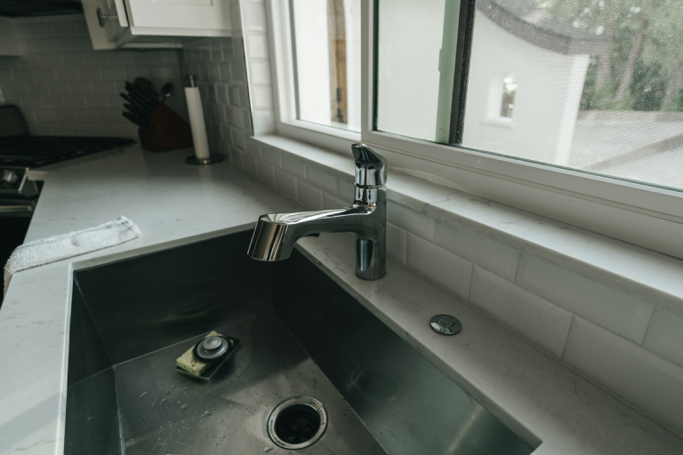 Let faucets in an open kitchen drip to prevent your pipes from freezing