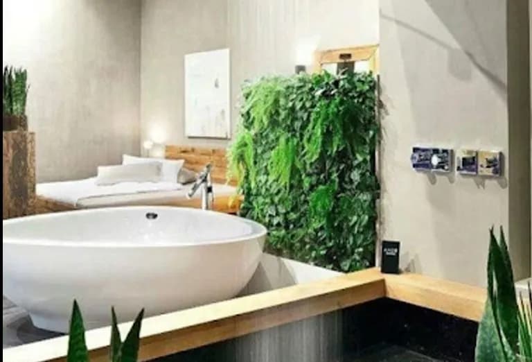 Concealed shower surrounded by plants in a home in Costa Rica