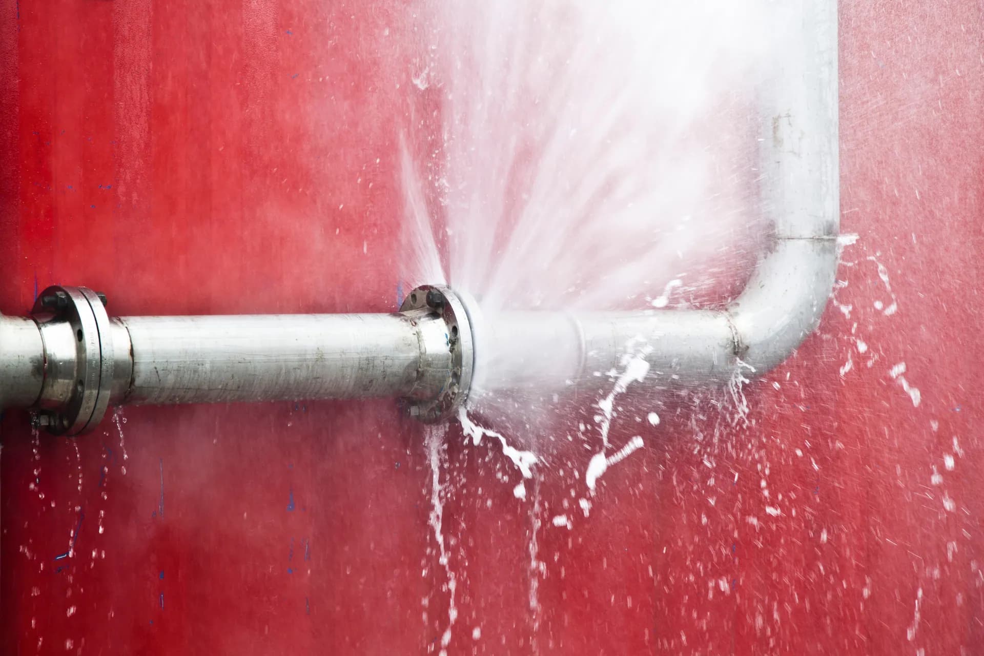 Water sprying out of a burst pipe