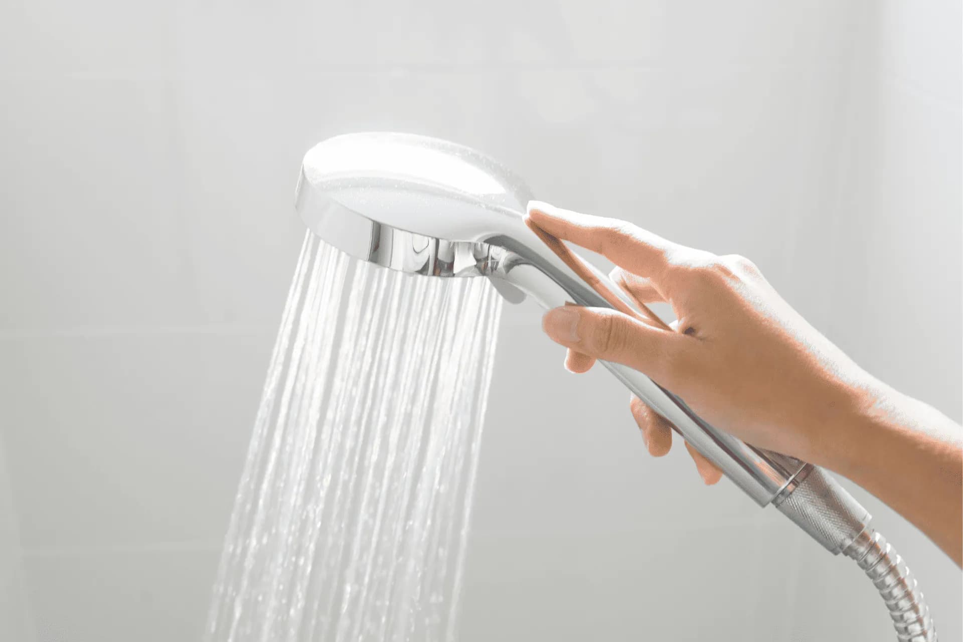 Water flowing from a showerhead