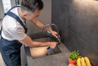 New kitchen faucet being installed
