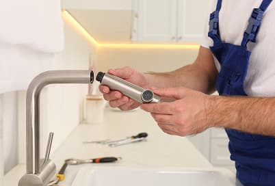 Dripping faucet being repaired