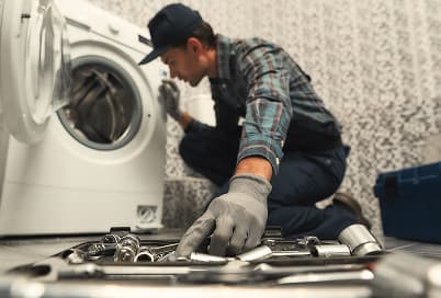 Washing machine hoses being connected