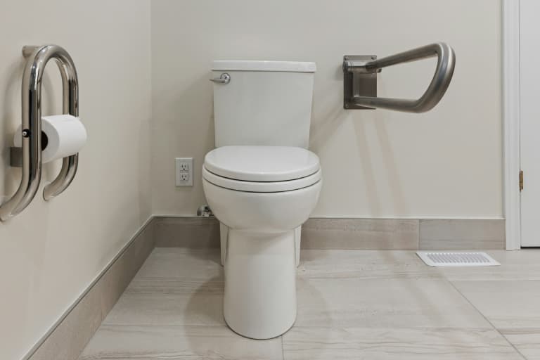 A white, clean toilet in a bathroom