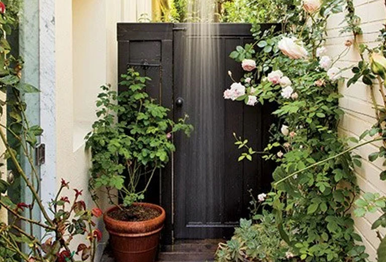 Shower beside roses in this Los Angeles home