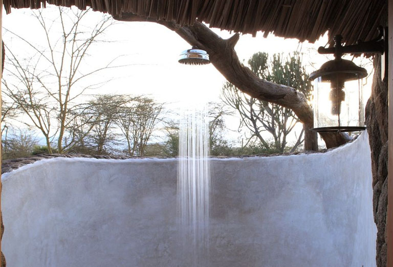 Outdoor shower with a bench