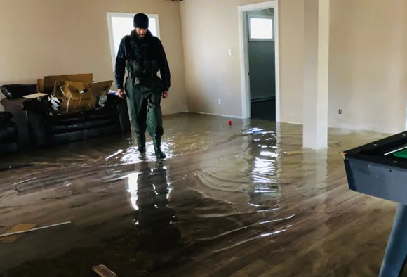 walking through a flooded house