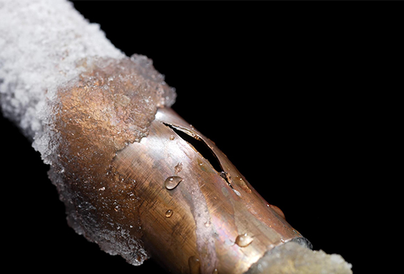  Close up of a frozen pipe showing pipe damage