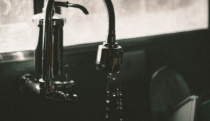 Close-up of a dripping faucet