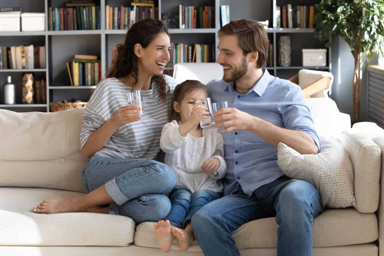 A family drinking water processed via a reverse osmosis system 