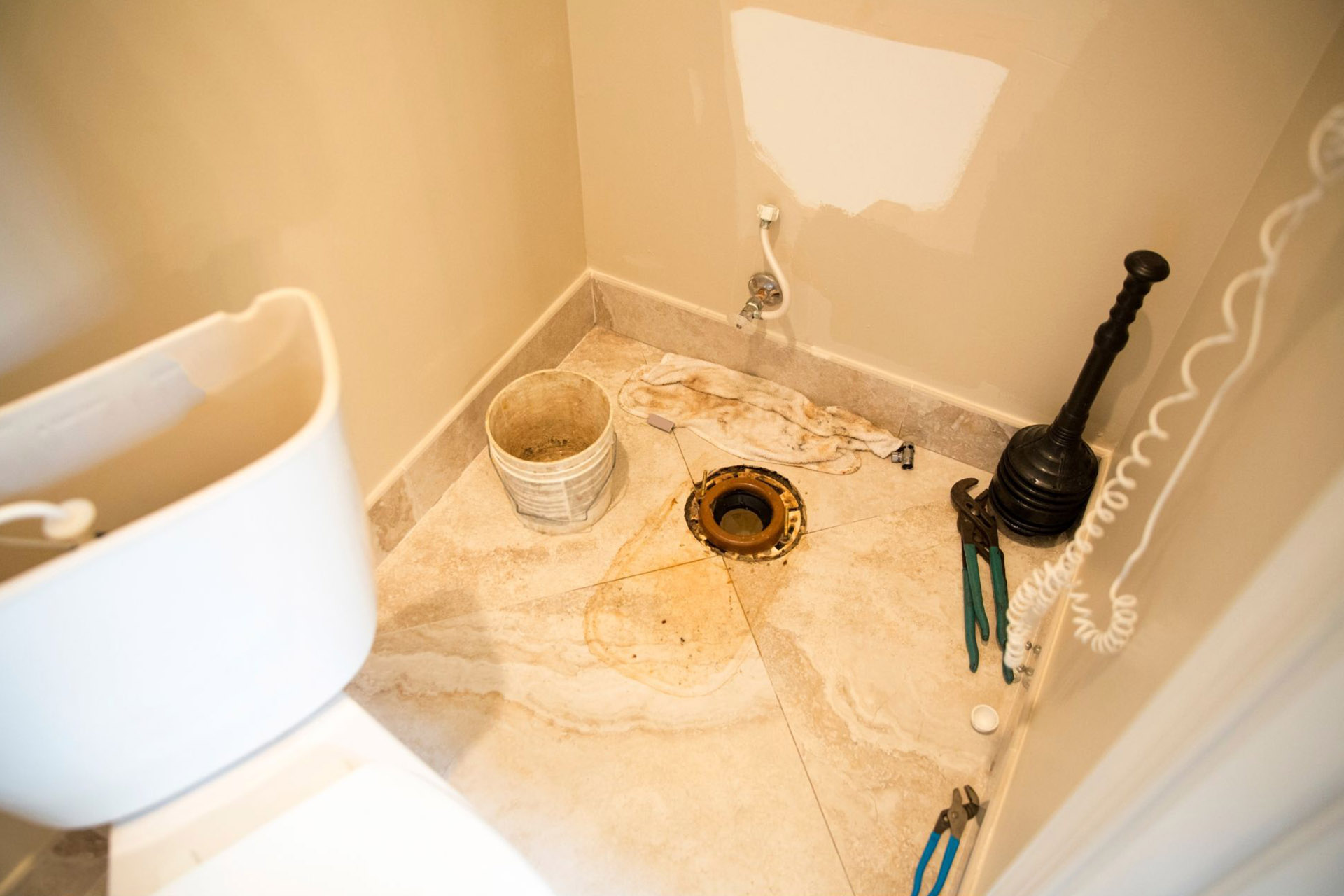 A toilet taken apart to have the toilet flange replaced