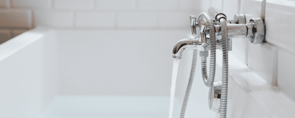 Water running from a tub spout with a shower diverter