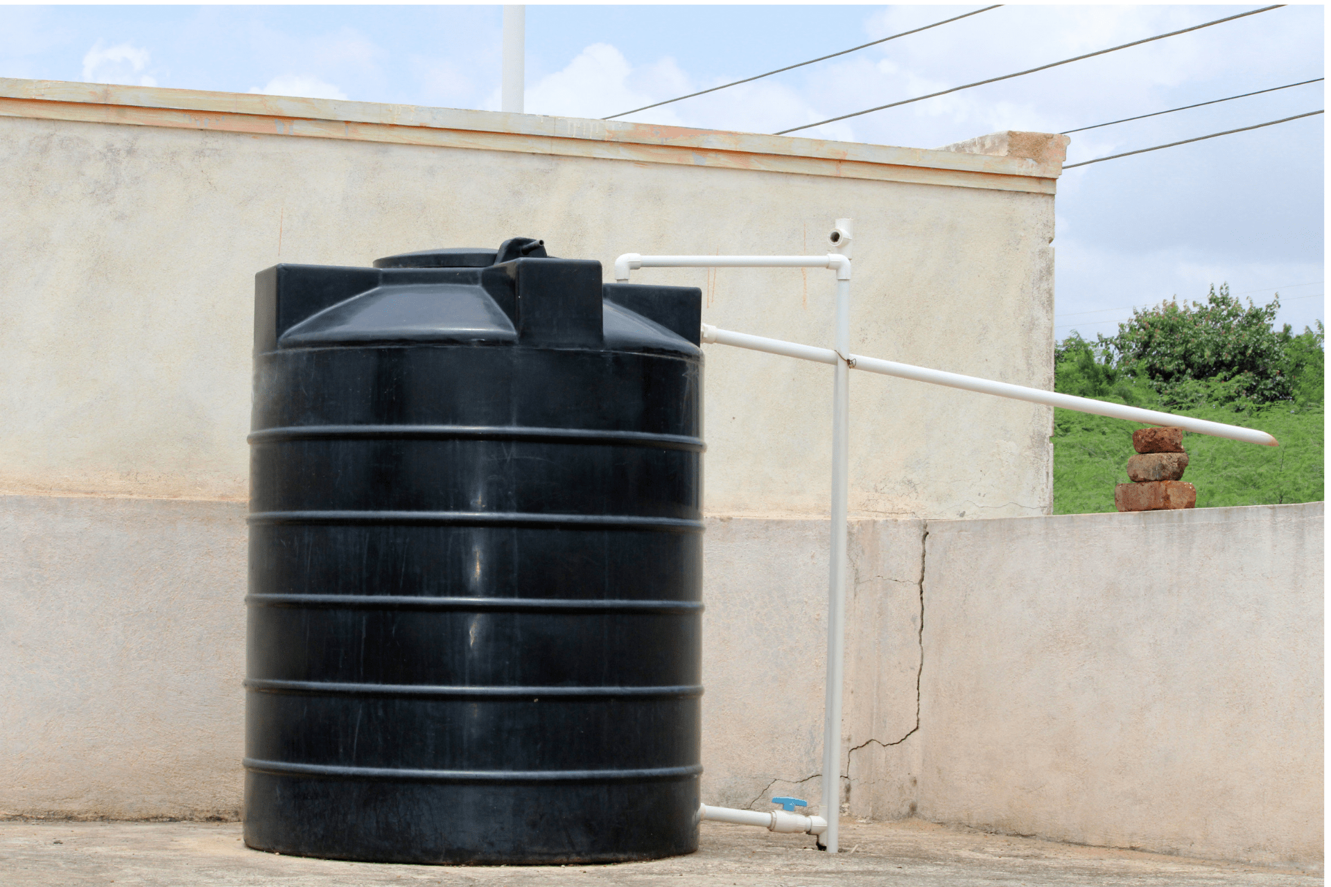 A water heater tank on a rooftop 