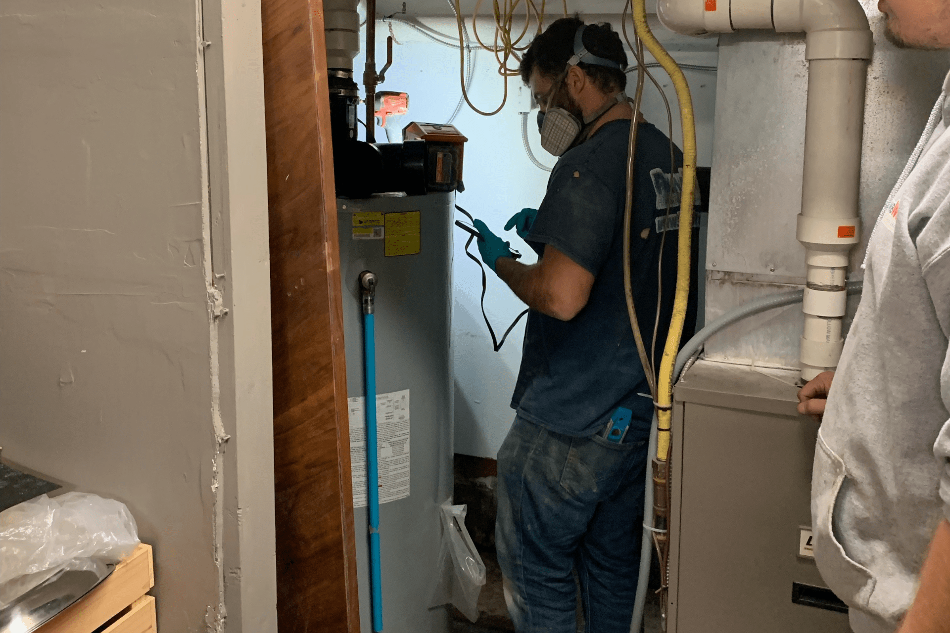 PlumbWize conducts regular maintenance on an electric water heater