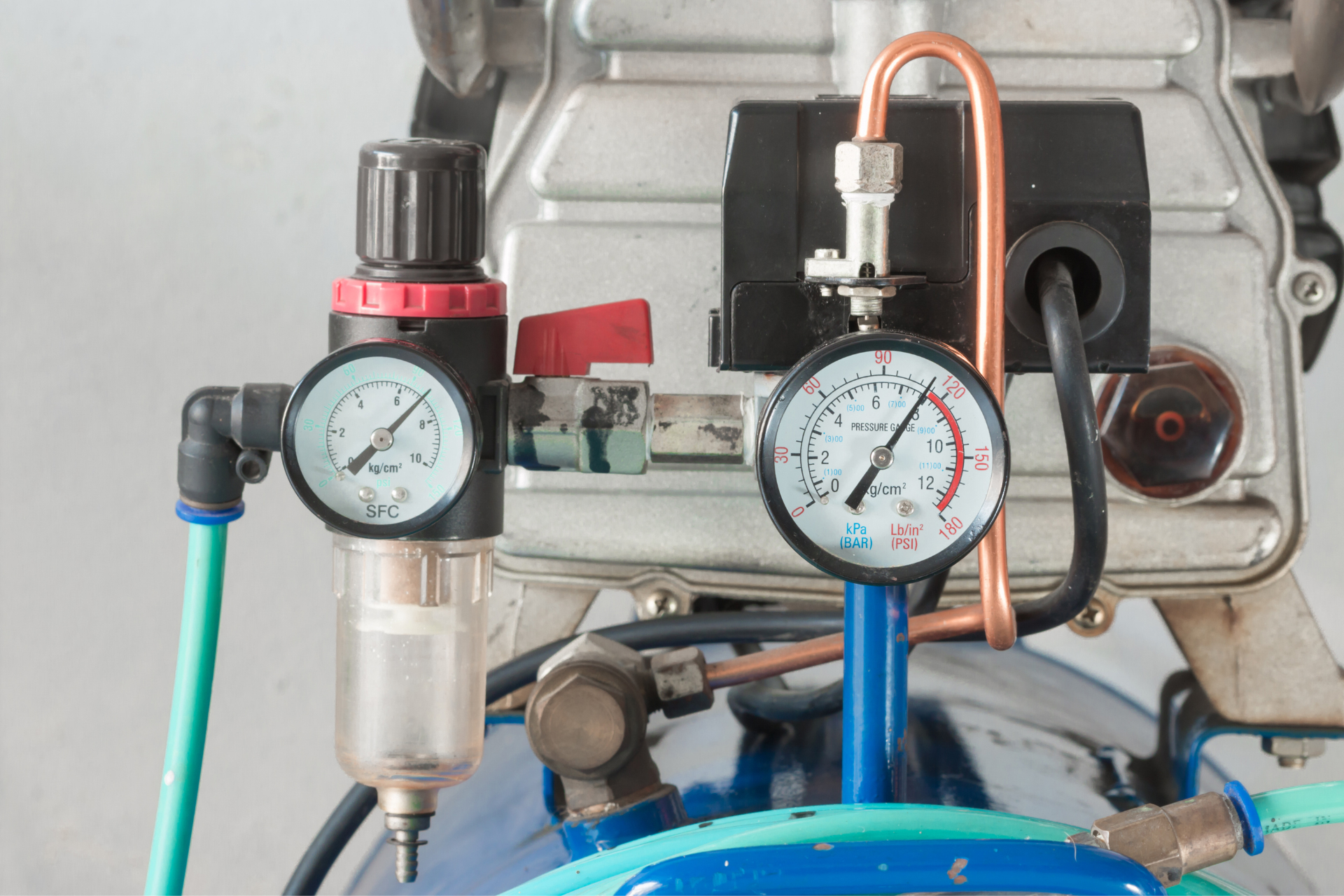 a close-up look at a water pressure regulator and its dials
