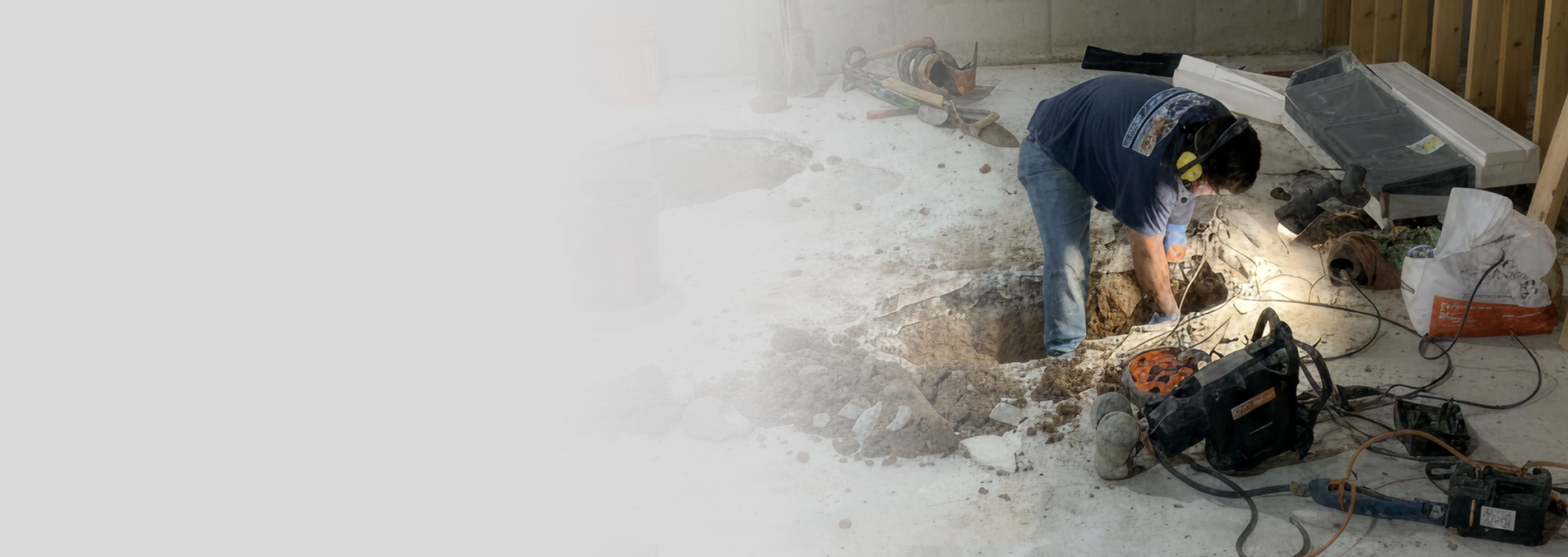 PlumbWize plumber replaces a sump pump in a basement